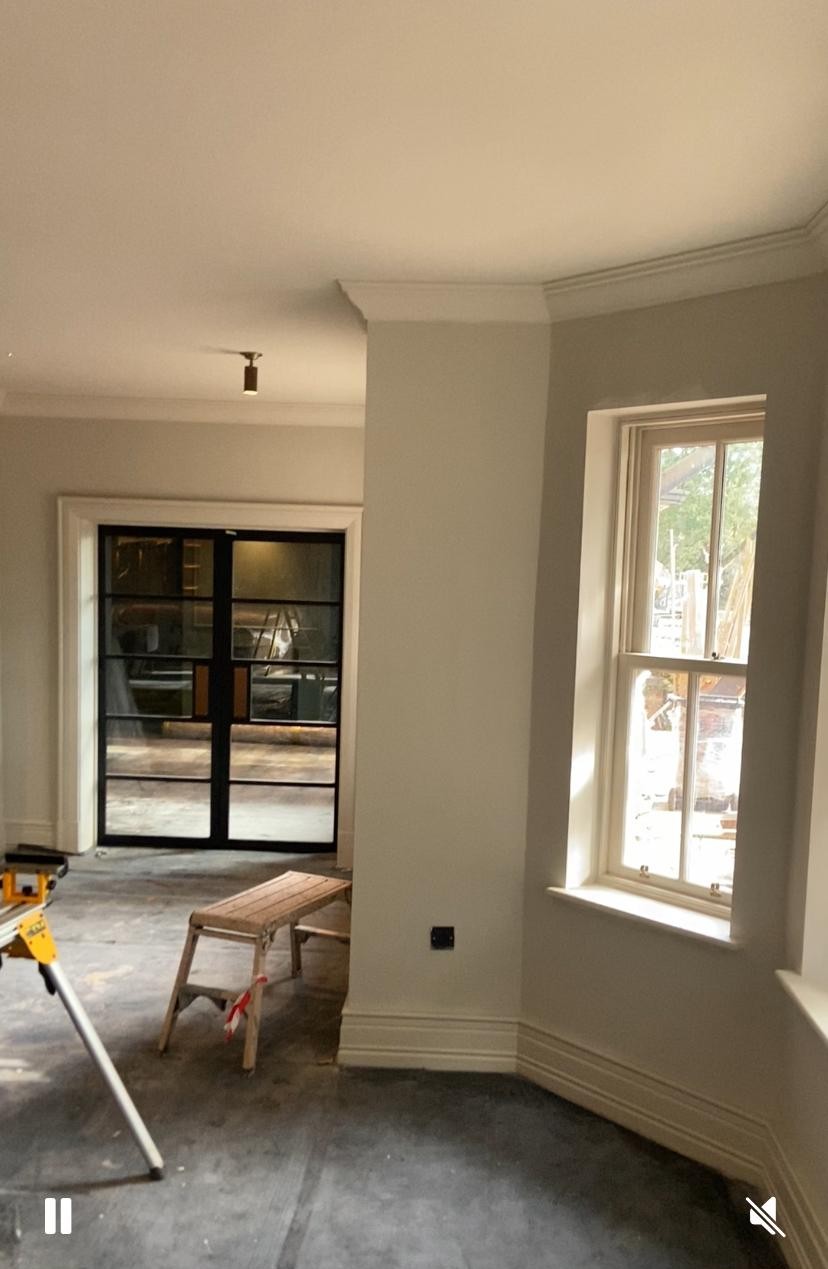 Hotel room walls and woodwork freshly painted
